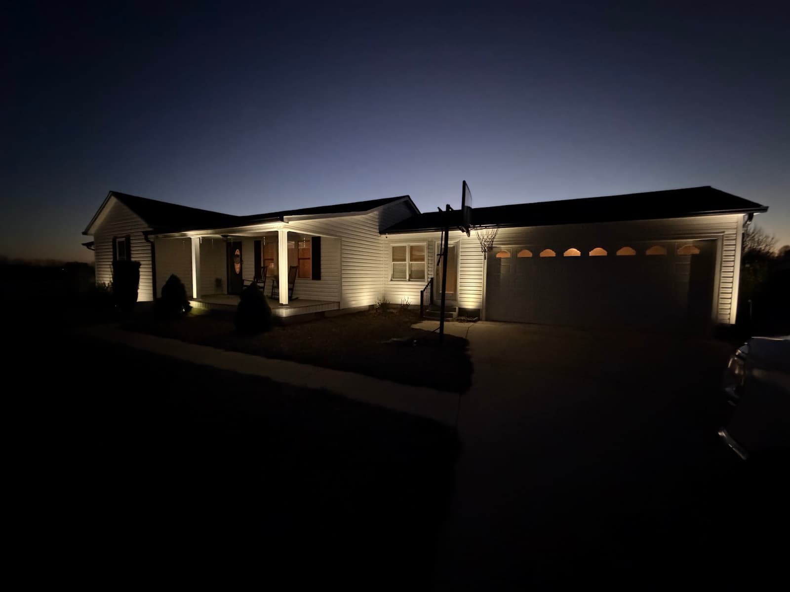 Cool white uplighting on a home in North Wilkesboro NC by Luna Vista Exterior Lighting